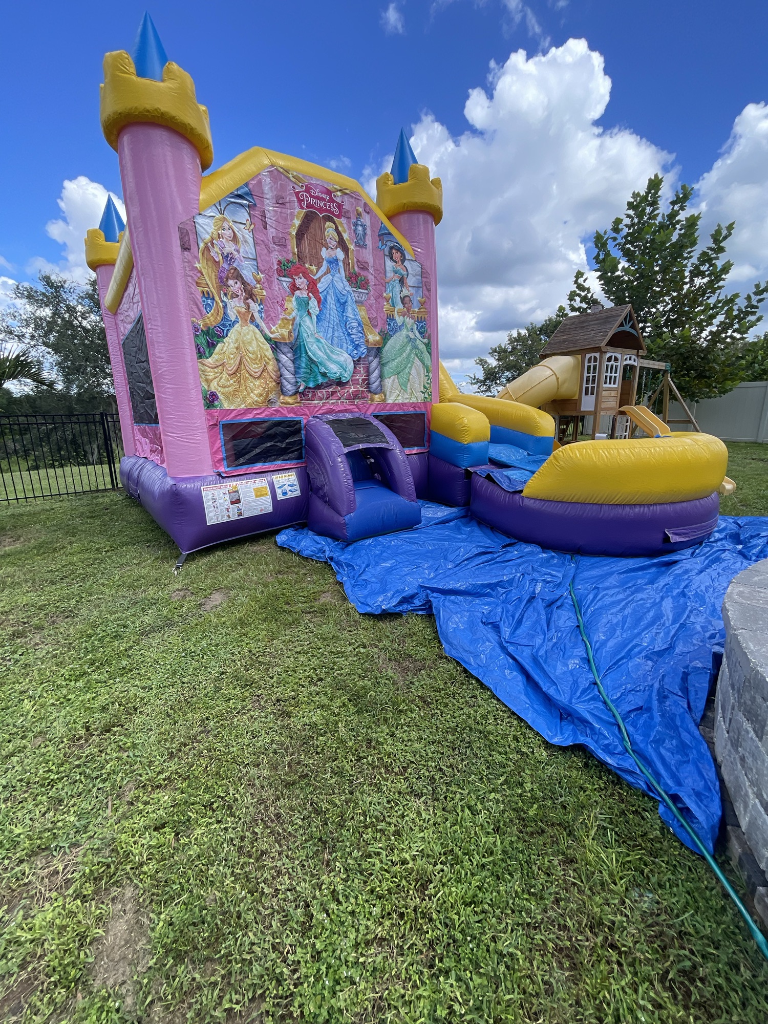 Themed bounce house combo set up for a backyard party in Apopka, Florida
