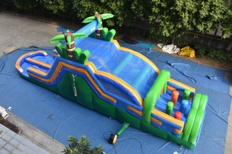 A large inflatable obstacle course with multi color obstacle and unit