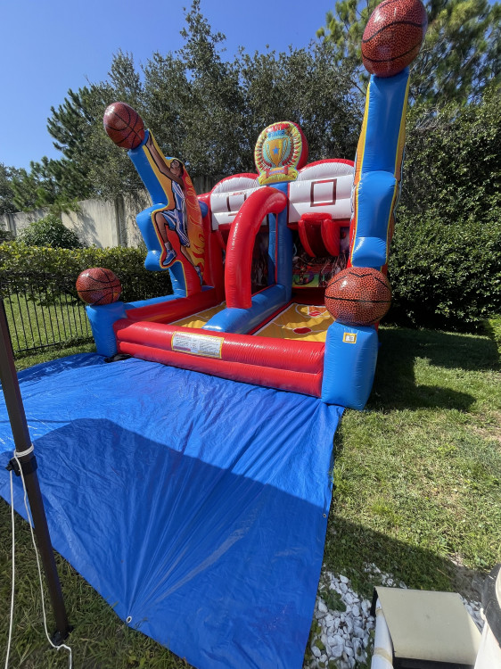 a inflatable basketball game that's red and blue ready for play